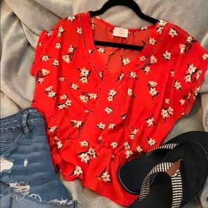 Sheer blood orange floral print peplum blouse.